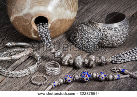 stock-photo-collection-of-antique-traditional-silver-jewelry-on-old-wood-322876544