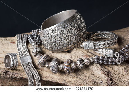 stock-photo-still-life-photography-collection-of-antique-traditional-silver-jewelry-on-old-wood-271851179